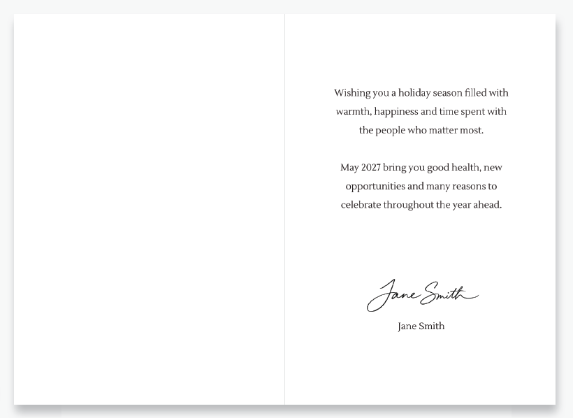 Open greeting card with a holiday message and signature